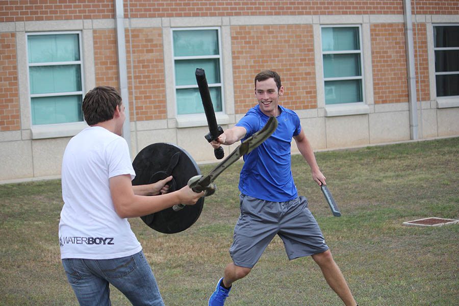  LARP club president Alex Bourland battles in front of the school during Advocate.