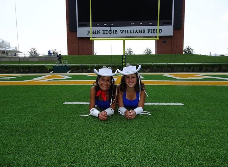 Rangerette and recent alumni Cierra Birmingham poses with her teammate in her Rangerette uniform on Williams Field.