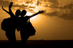 couple-best-friends-taking-selfie-sunset-70192435