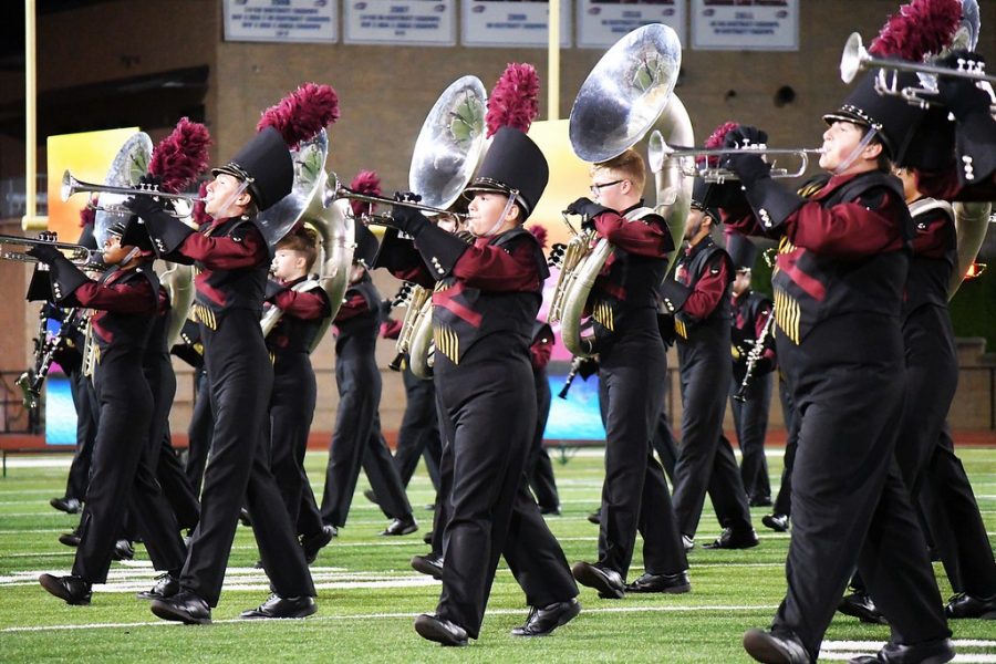 MARCHING ON Brass players Sheila Stroud, Zane Biscoe, Maddi Pate, Zach Dommenge, Matthew Drum perform American Tapestries during halftime at the Pflugerville game.