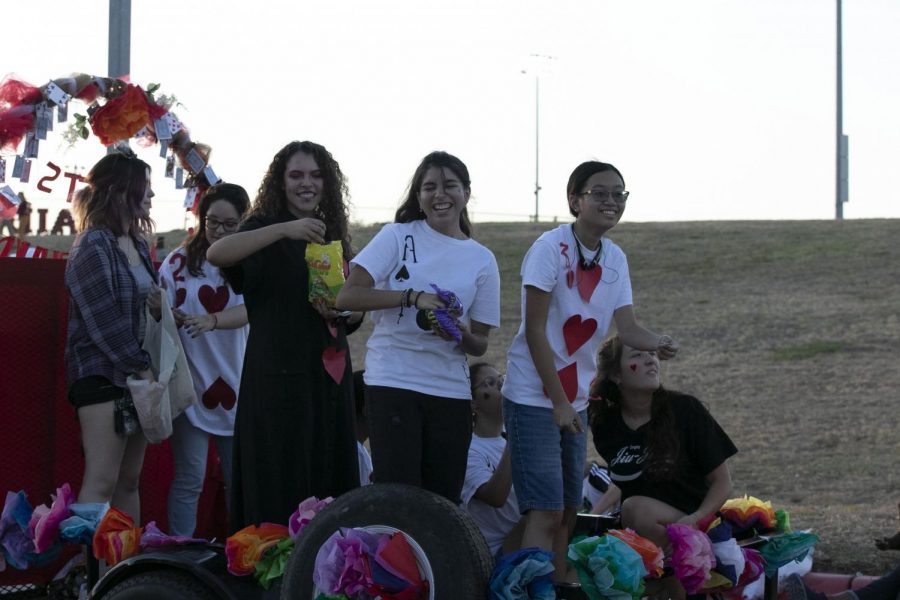 Social media officer Isabella Fritch Macias, Vice President Vicktoria Ramos and Historian Viviana Phan throw candy at Homecoming parade