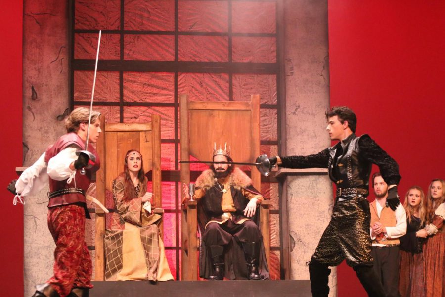 Queen Gertrude 12, King Claudius 11, watch intensely as Laertes 12 and Hamlet 11 duel. 