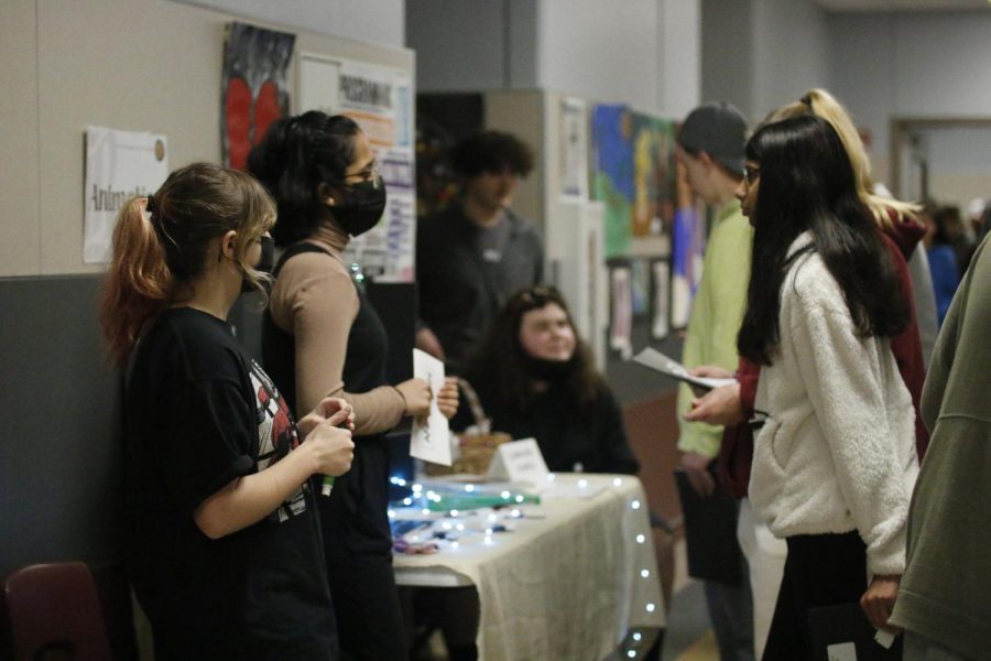 Art students answer questions during this years CTE Fair.