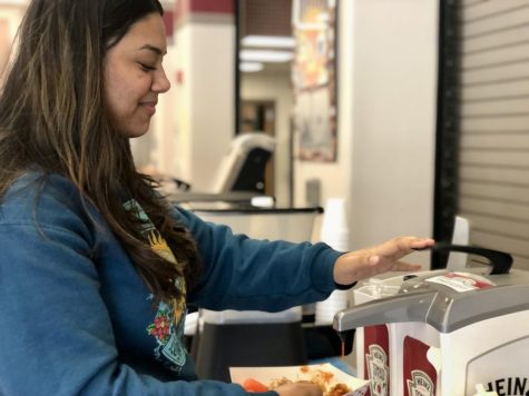 Sophomore Saanvi Lamichance grabs school lunch from Rouse High School’s cafeteria. Taken by Connie Cooper, 1/3/23