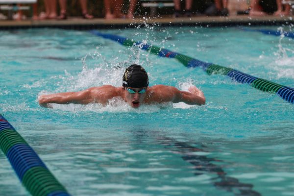 Senior Logan Lacombe swims the butterfly in the Tri Meet at Blockhouse on September 16 against Leander and Glenn High School. 
