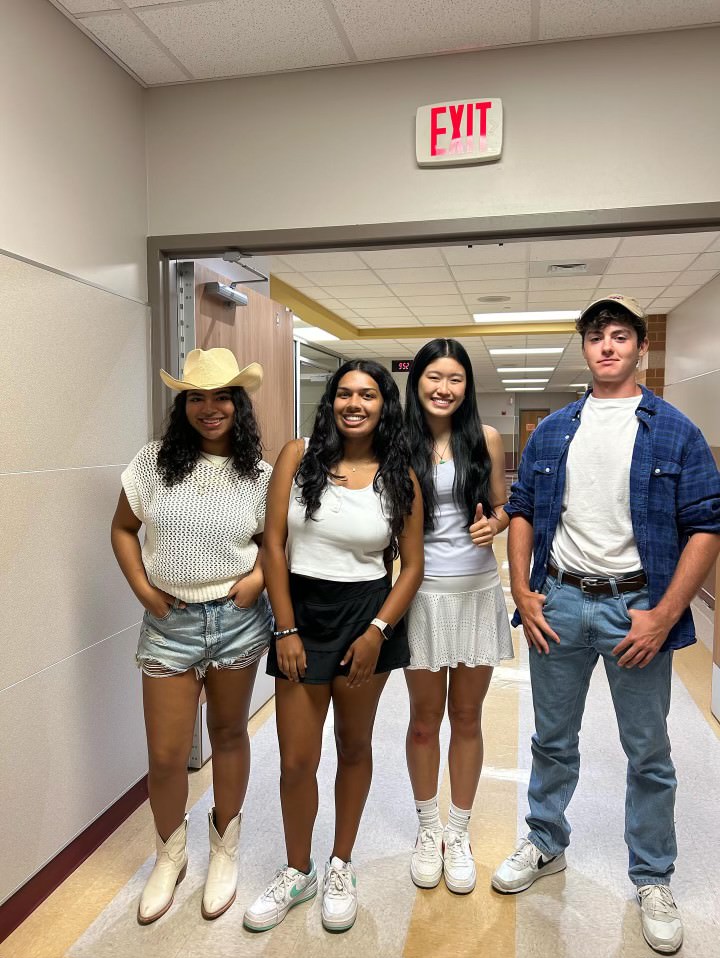 Surrounded by Student Council members, senior Riya Sengupta wears her country fit. She dressed for the Country vs Country Club theme day. “I think theme days are a really important part of our school culture so I chose to participate in the Country vs Country Club theme day,” Sengupta said. “I love dressing up and showing spirit for my school on game days and it’s just fun to dress up like a cowgirl every now and then.”