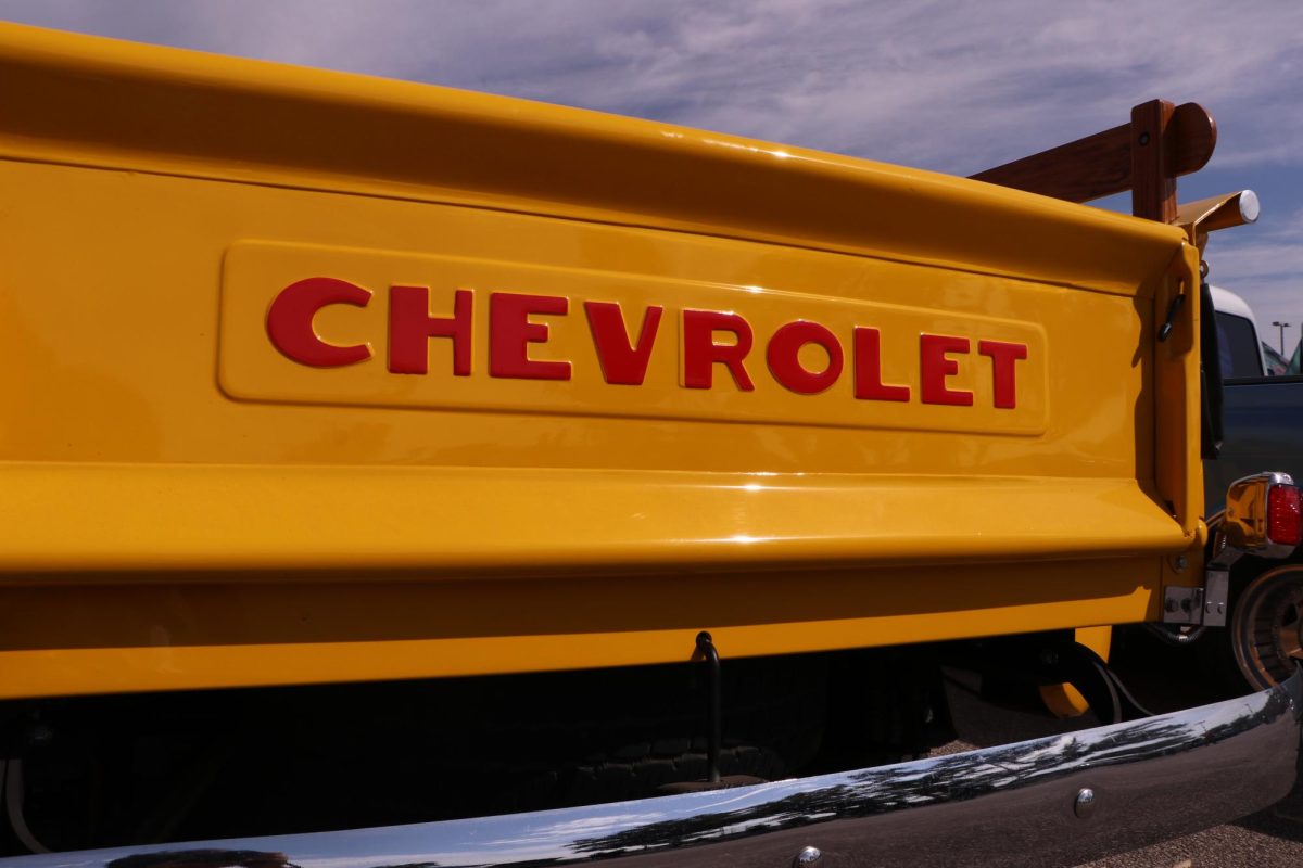 A bright, close-up logo of an old Chevrolet