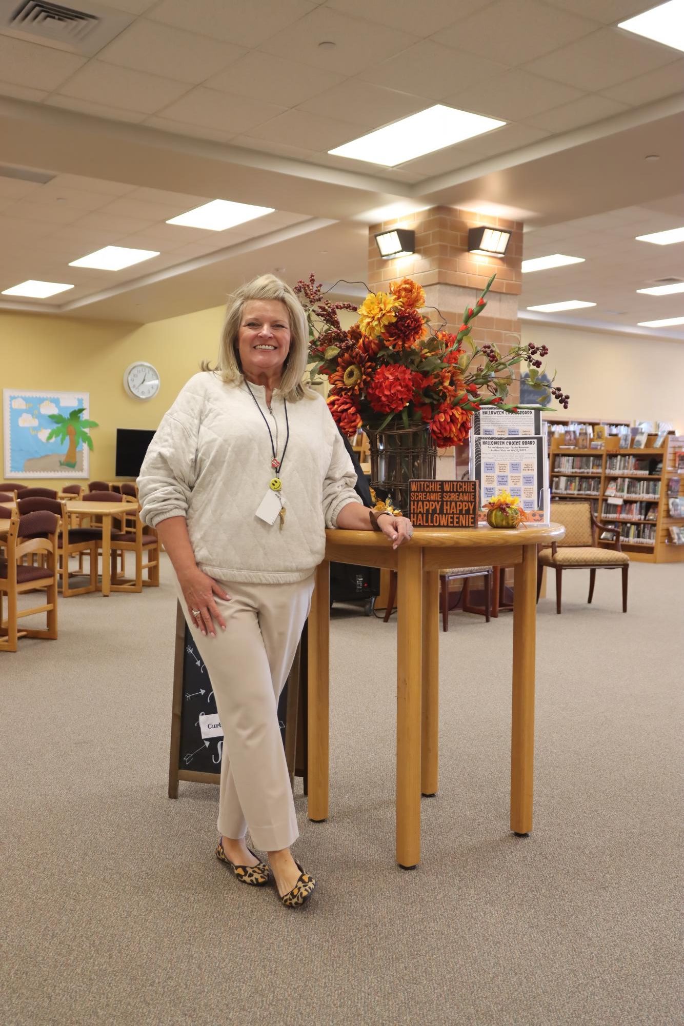 Mrs. Hensley stands next to the announcement table that changes out throughout the school year. “I love your faces,” Hensley said. “I'm gonna miss you guys. It's been a great honor to serve you all here at Rouse.”