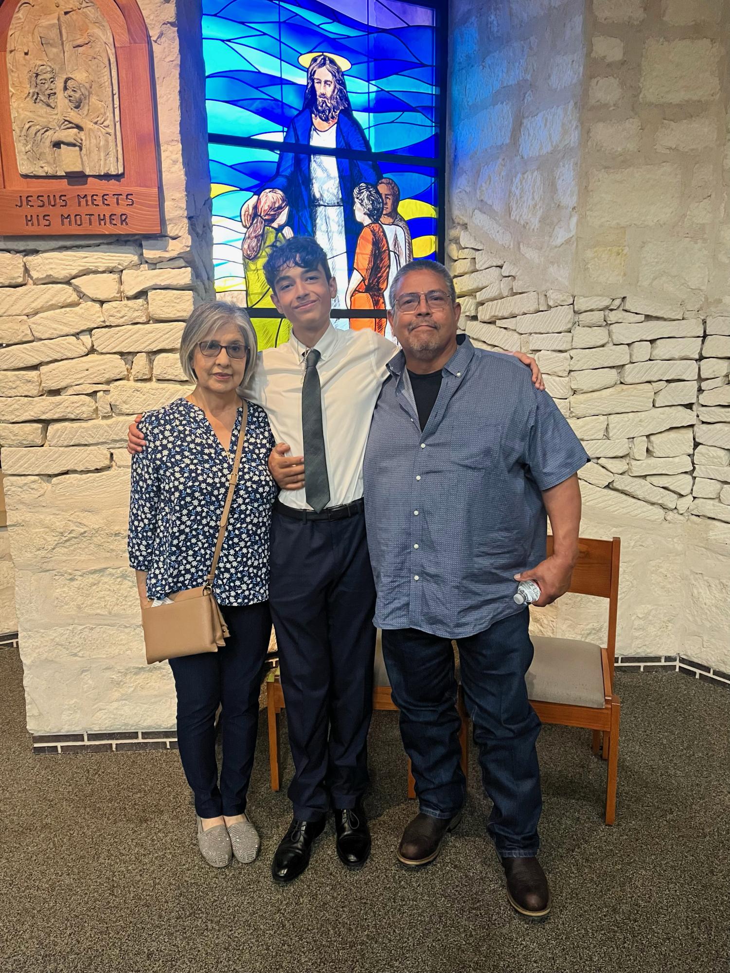 With a cheerful smile, senior Max Cole embraces his grandparent’s presence. He got confirmed at St. Margaret Mary Church. “It was such a long journey to be confirmed but having my close family come into town to such a special celebration of my faith meant everything to me,” Cole said.