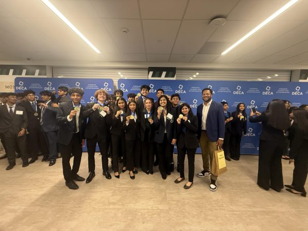 The DECA officers celebrate after district competition at McNeil High School. Photo by senior Hansi Kallem.