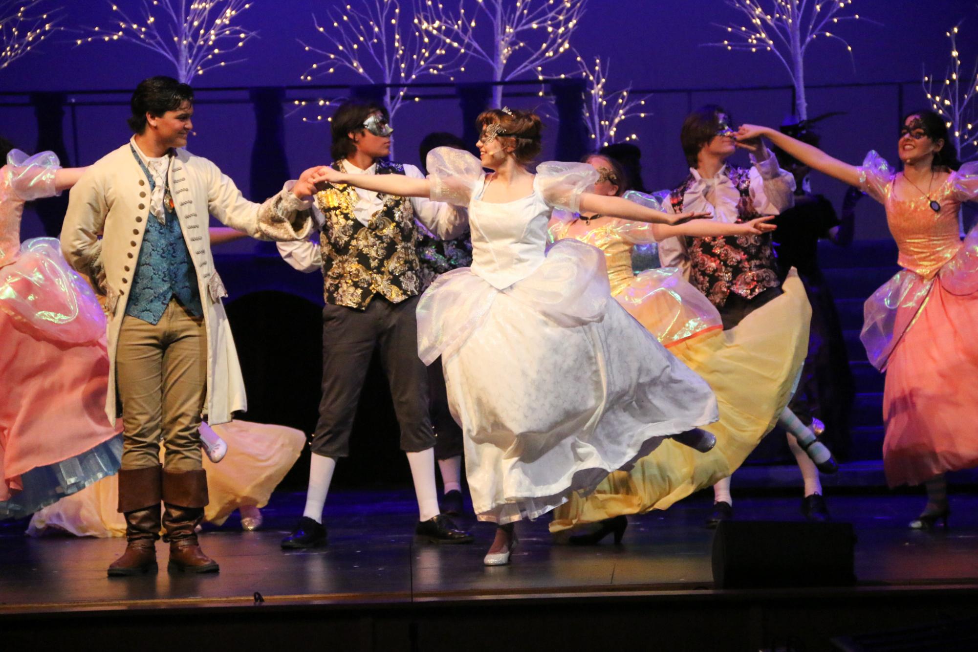 Cinderella and Prince Topher dance together in the masquerade ball.