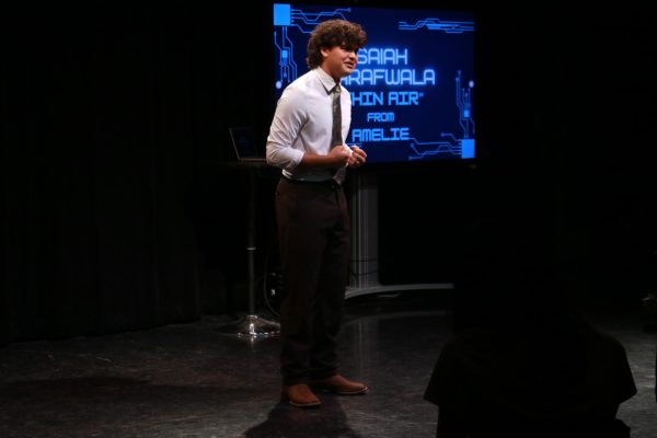 Senior Isaiah Barafwala performs the number "Thin Air" during the varsity theatre showcase.