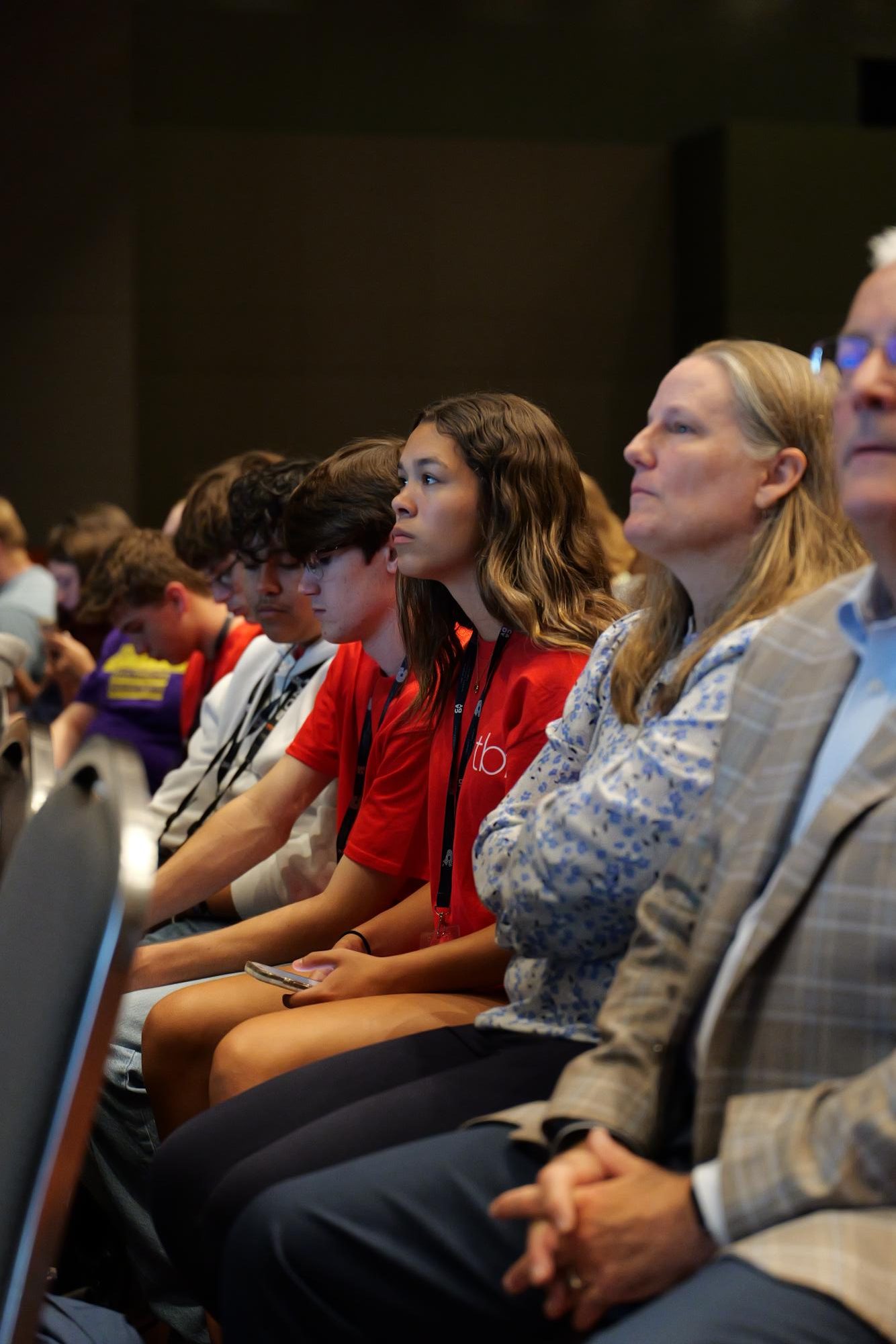 At the ending ceremony of the Fall Fiesta TAJE convention, student journalists listen to New Voices Texas's presentation. 