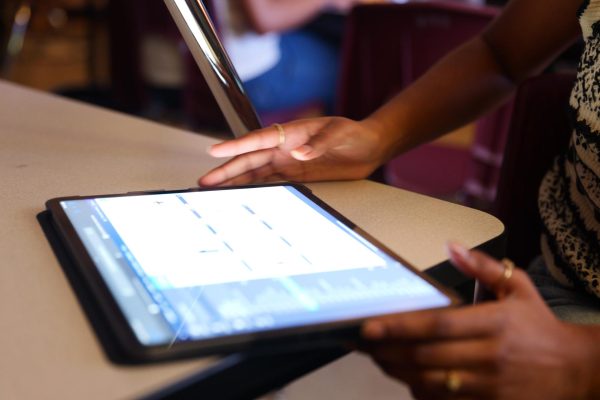 This photo was taken in 2024 prior to new legislation. Senior Neha Allamneni regularly used an iPad to create cutouts for yearbook, but now due to HB 1481 iPads are no longer permitted in the classroom. 
