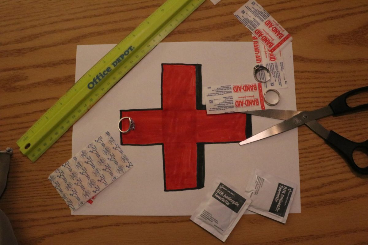 Reading the articles put out about Senate Bill 12, Davila sits down at her desk and brings what she sees to life via a quick drawing and the medical supplies she has in her bag in the event someone needs it. Photo by Juni Davila.