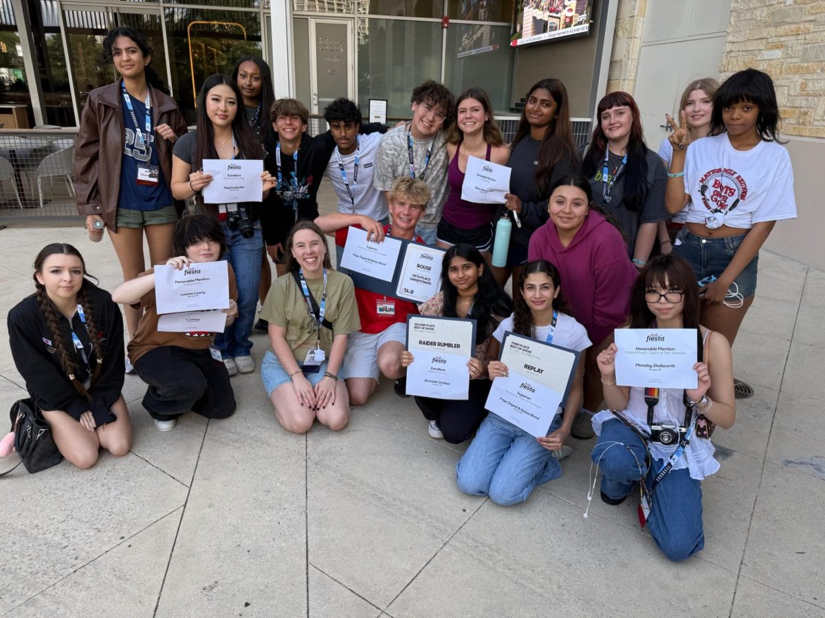 Newspaper and yearbook staffers stand outside the convention center following the awards ceremony.