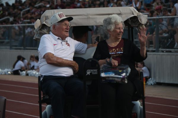 Mr and Mrs Rouse wave and greet students and staff at the homecoming parade. Photo by Katie Mathews.